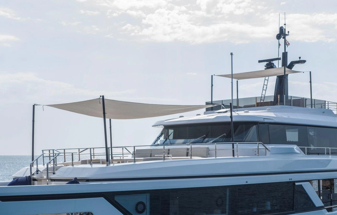 A sleek yacht with modern design elements and shaded outdoor areas. aboard CLAIRE DE LUNE Yacht for Sale