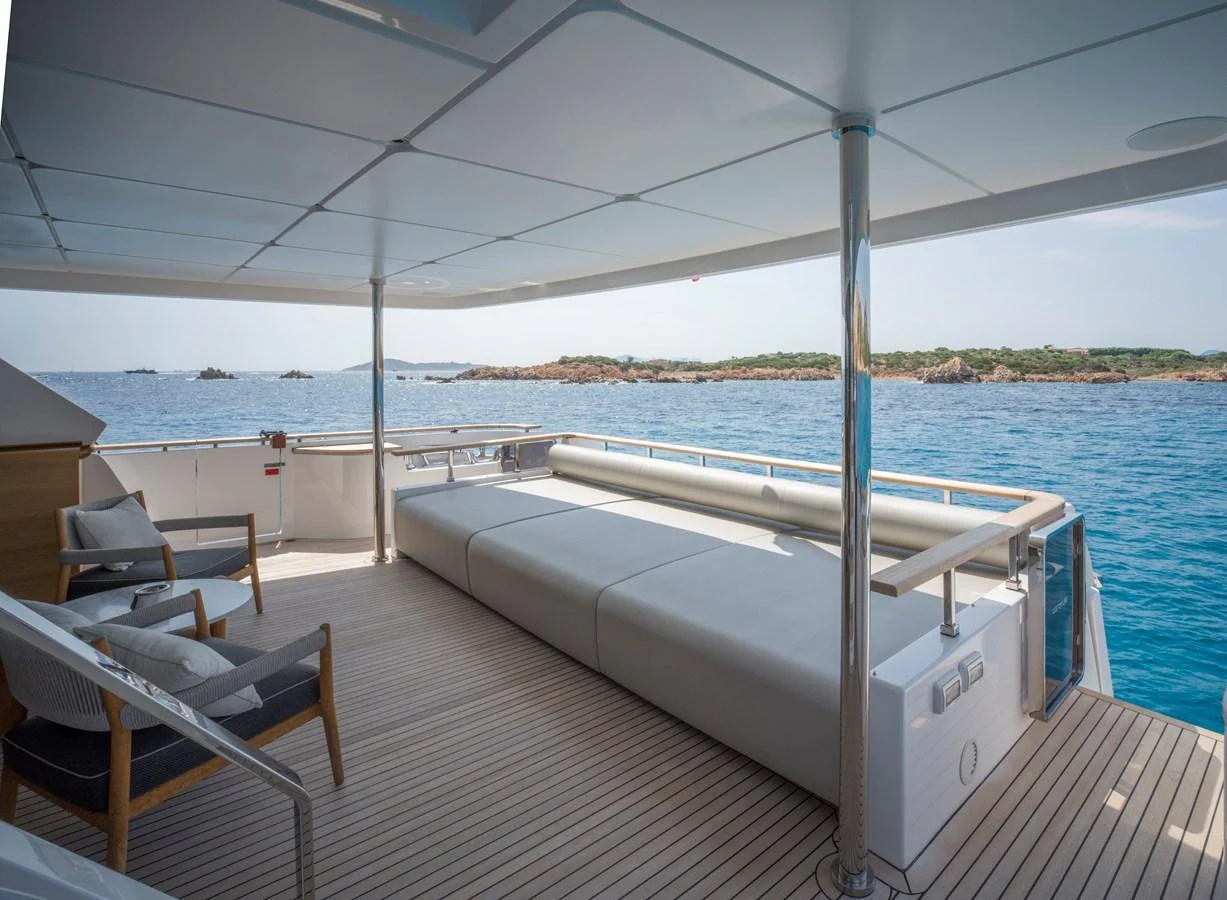 The aft deck features a spacious lounging area with comfortable seating and stunning ocean views. aboard CLAIRE DE LUNE Yacht for Sale