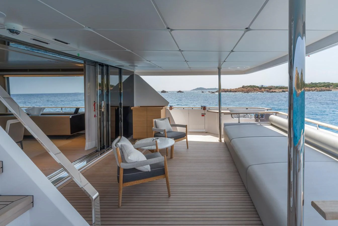 The aft deck offers a spacious and inviting area with comfortable seating and stunning ocean views. aboard CLAIRE DE LUNE Yacht for Sale