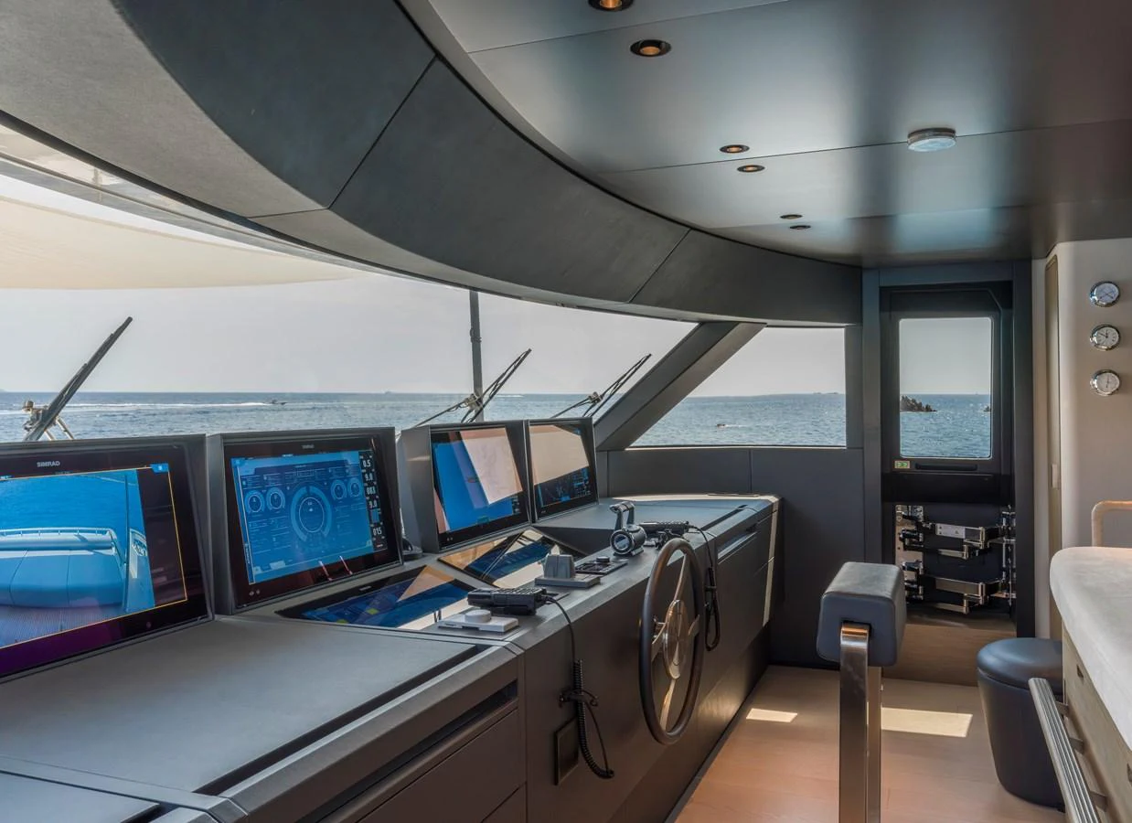 The helm station offers a sleek and modern control area with advanced navigation equipment and panoramic views. aboard CLAIRE DE LUNE Yacht for Sale