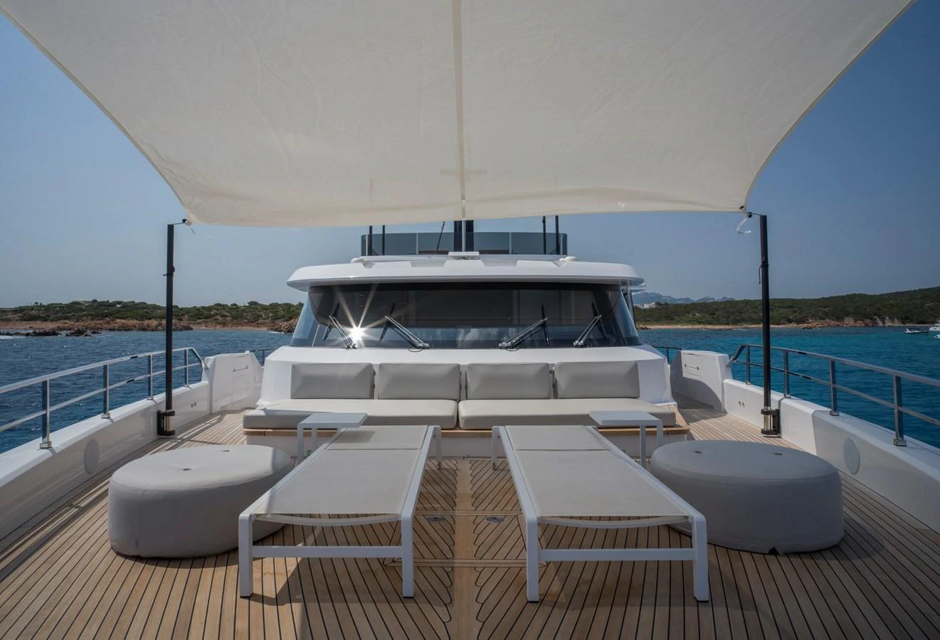 The sundeck offers a spacious and relaxing area with sun loungers and a shaded canopy, perfect for enjoying the sea views. aboard CLAIRE DE LUNE Yacht for Sale