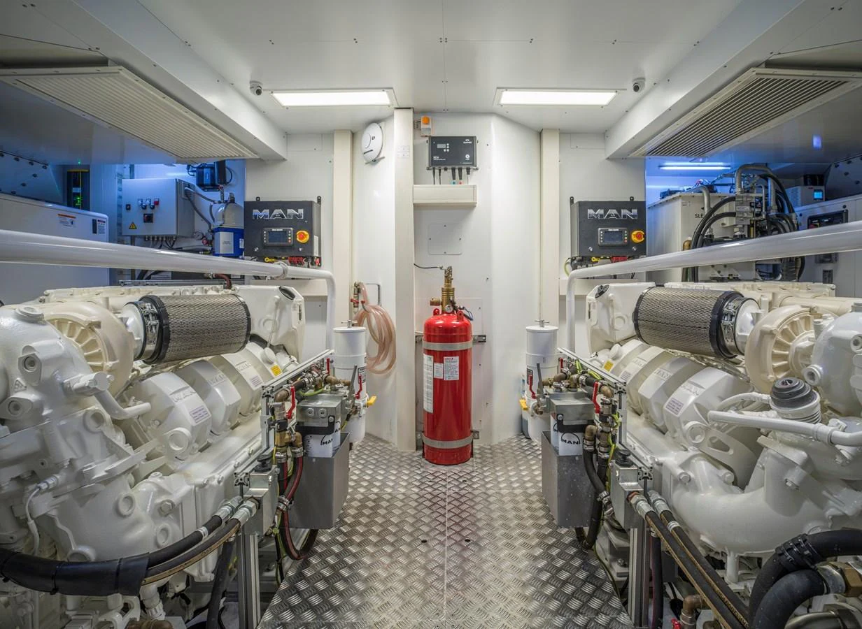 The image showcases a pristine engine room with advanced machinery and equipment. aboard CLAIRE DE LUNE Yacht for Sale