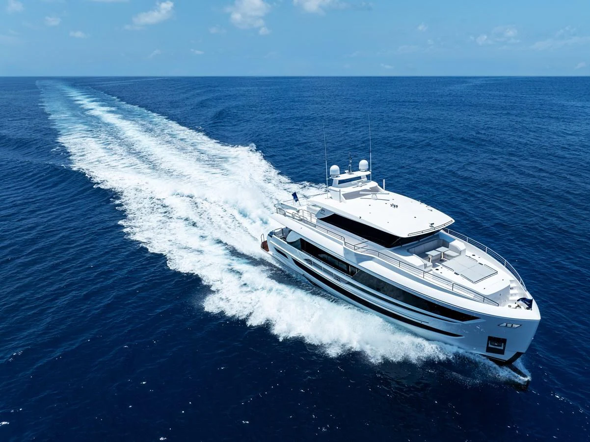 A sleek and modern yacht cruises swiftly through the open sea, leaving a trail of white wake behind. aboard HORIZON FD80/19 Yacht for Sale