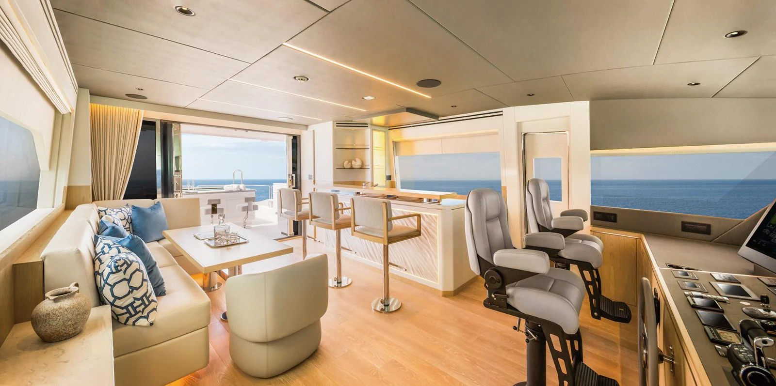 The yacht's salon offers a spacious and luxurious seating area with panoramic ocean views. aboard HORIZON FD80/19 Yacht for Sale