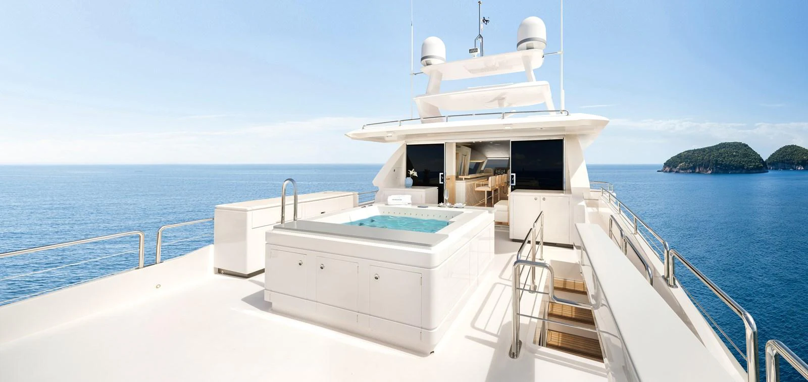 The sundeck features a luxurious jacuzzi with stunning ocean views. aboard HORIZON FD80/19 Yacht for Sale