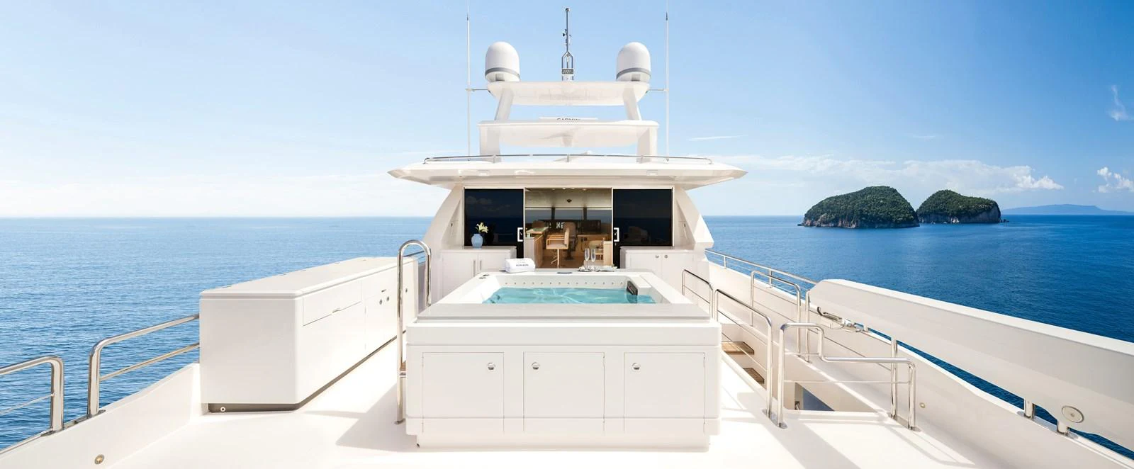 The sundeck features a luxurious jacuzzi with stunning ocean views. aboard HORIZON FD80/19 Yacht for Sale