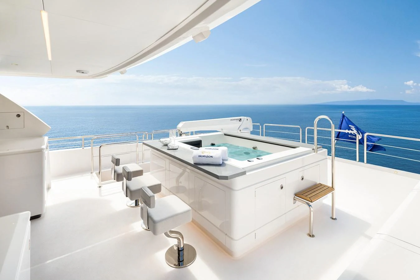 The sundeck features a luxurious hot tub with stunning ocean views. aboard HORIZON FD80/19 Yacht for Sale