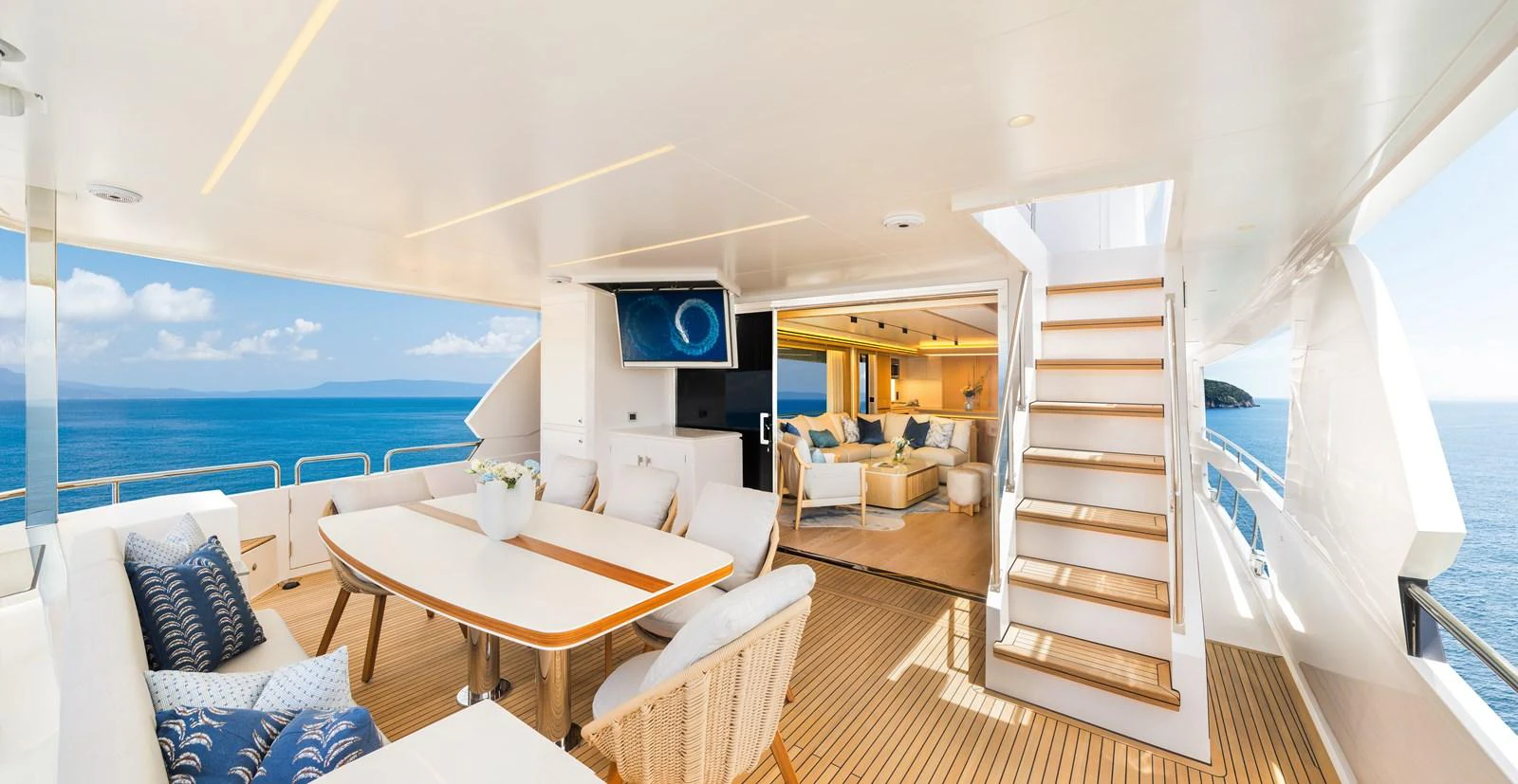 The aft deck offers a luxurious seating area with a stunning view of the ocean. aboard HORIZON FD80/19 Yacht for Sale