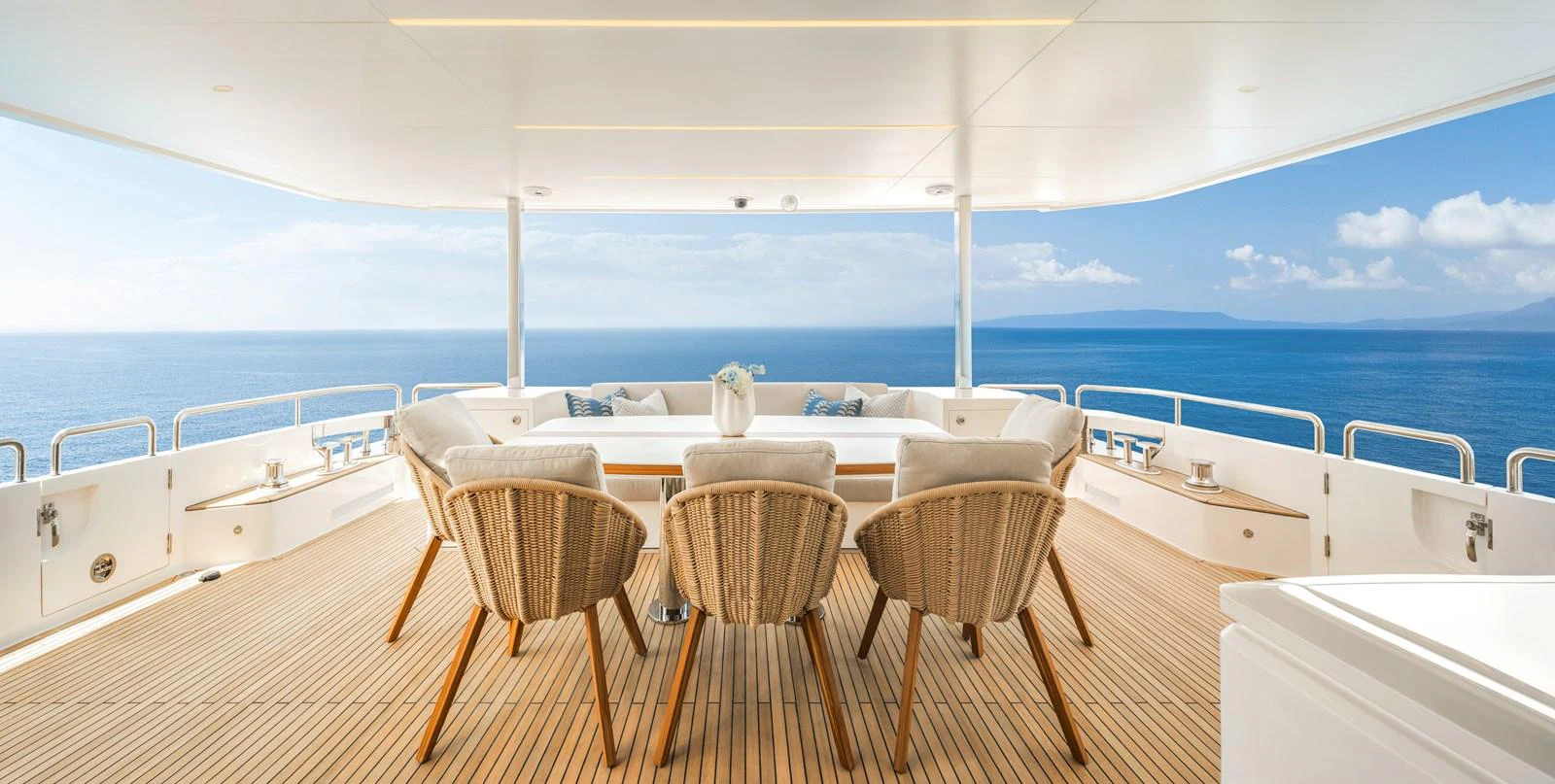 The aft deck offers a serene seating area with panoramic ocean views. aboard HORIZON FD80/19 Yacht for Sale