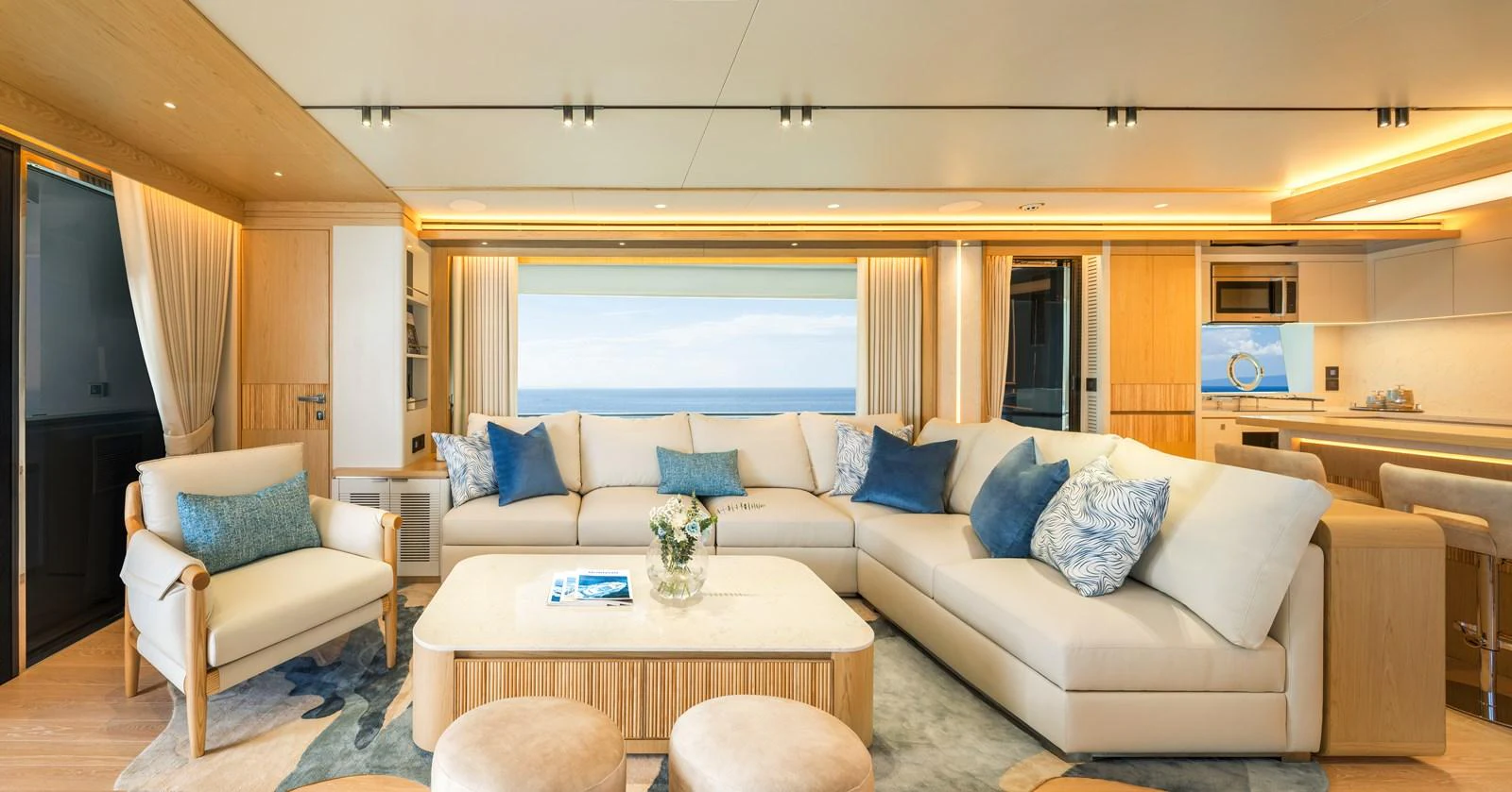 The salon features a spacious and elegant seating area with a panoramic ocean view. aboard HORIZON FD80/19 Yacht for Sale
