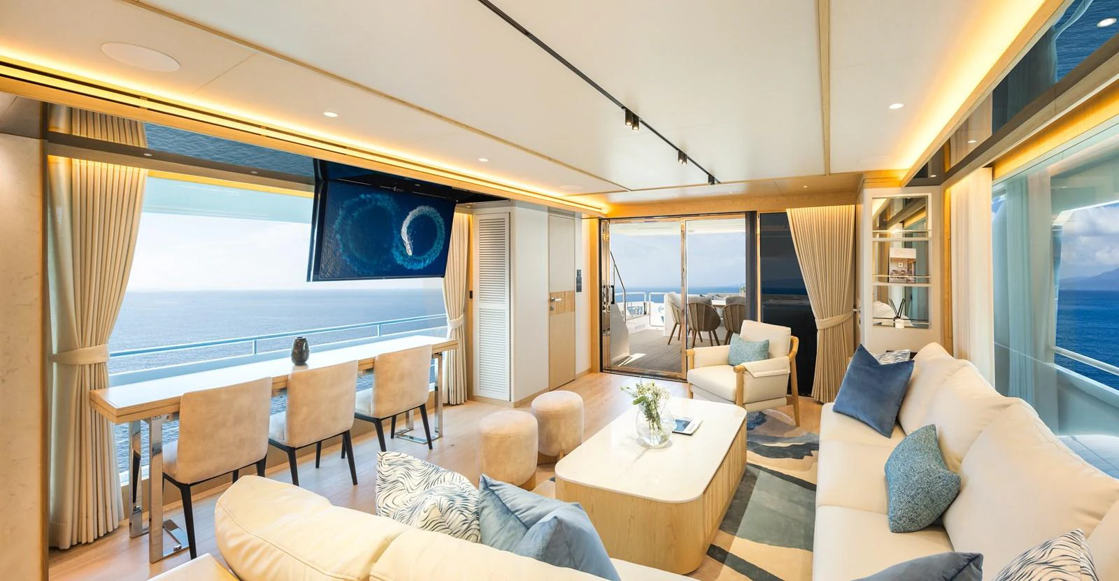 The yacht's salon offers a luxurious and spacious area with panoramic ocean views and elegant furnishings. aboard HORIZON FD80/19 Yacht for Sale
