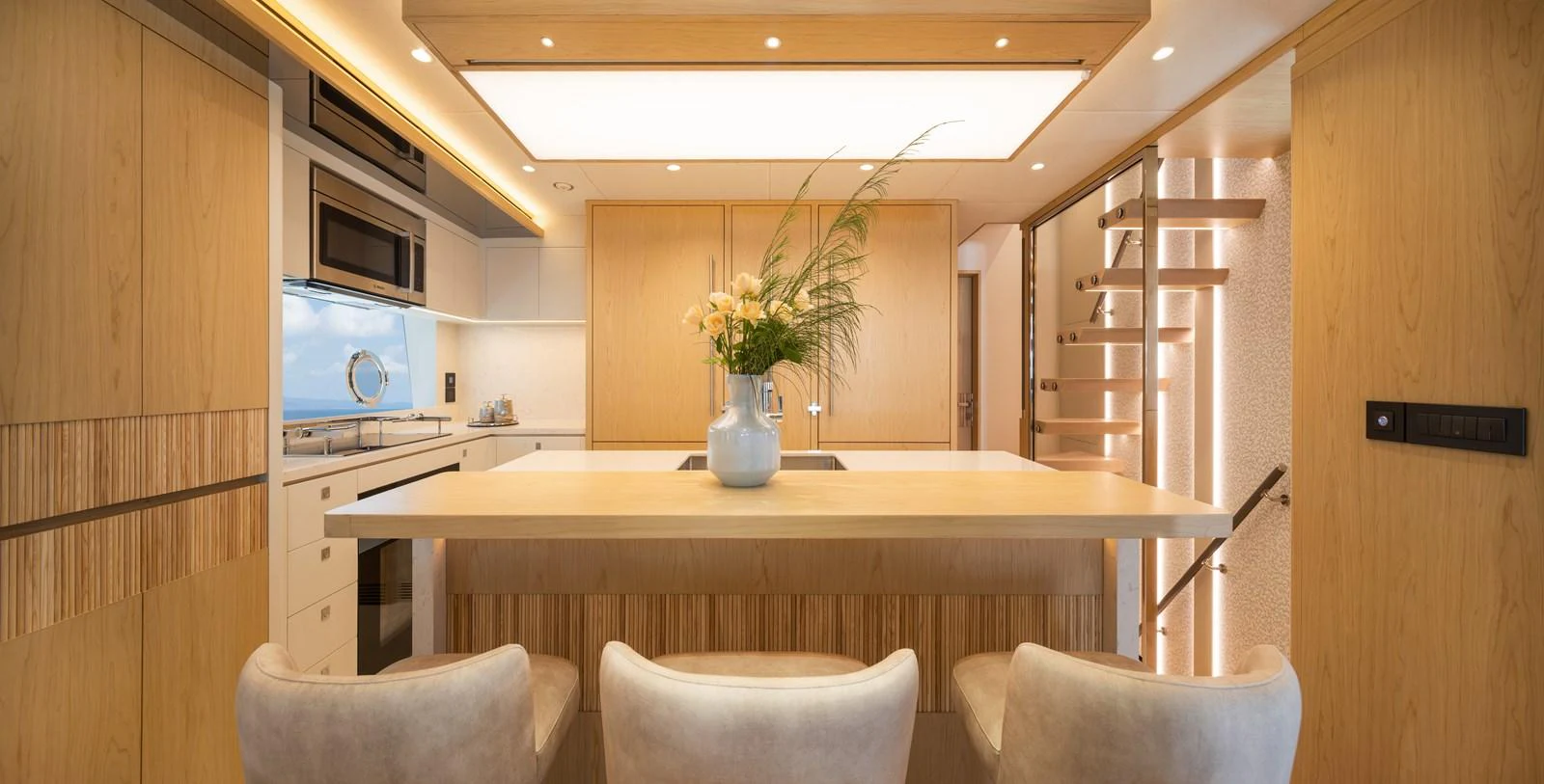 The galley features modern appliances, a spacious countertop, and elegant lighting. aboard HORIZON FD80/19 Yacht for Sale