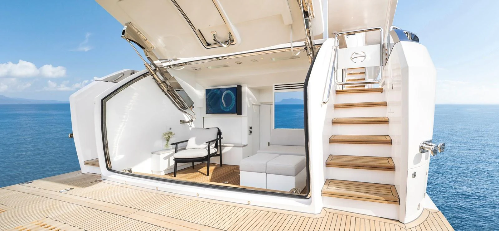 The yacht's beach club offers a luxurious space for relaxation with direct access to the sea. aboard HORIZON FD80/19 Yacht for Sale