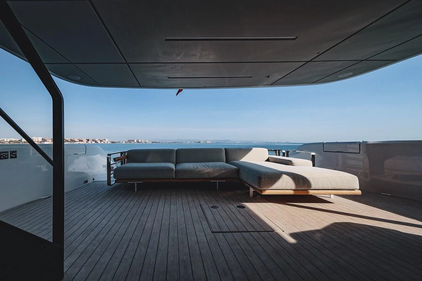 The aft deck features a spacious and comfortable seating area with panoramic ocean views. aboard SEA SAKURA Yacht for Sale