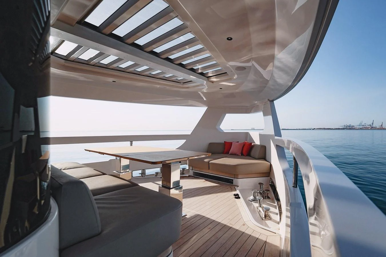 The aft deck offers a spacious and luxurious outdoor seating area with a stunning view of the sea. aboard SEA SAKURA Yacht for Sale