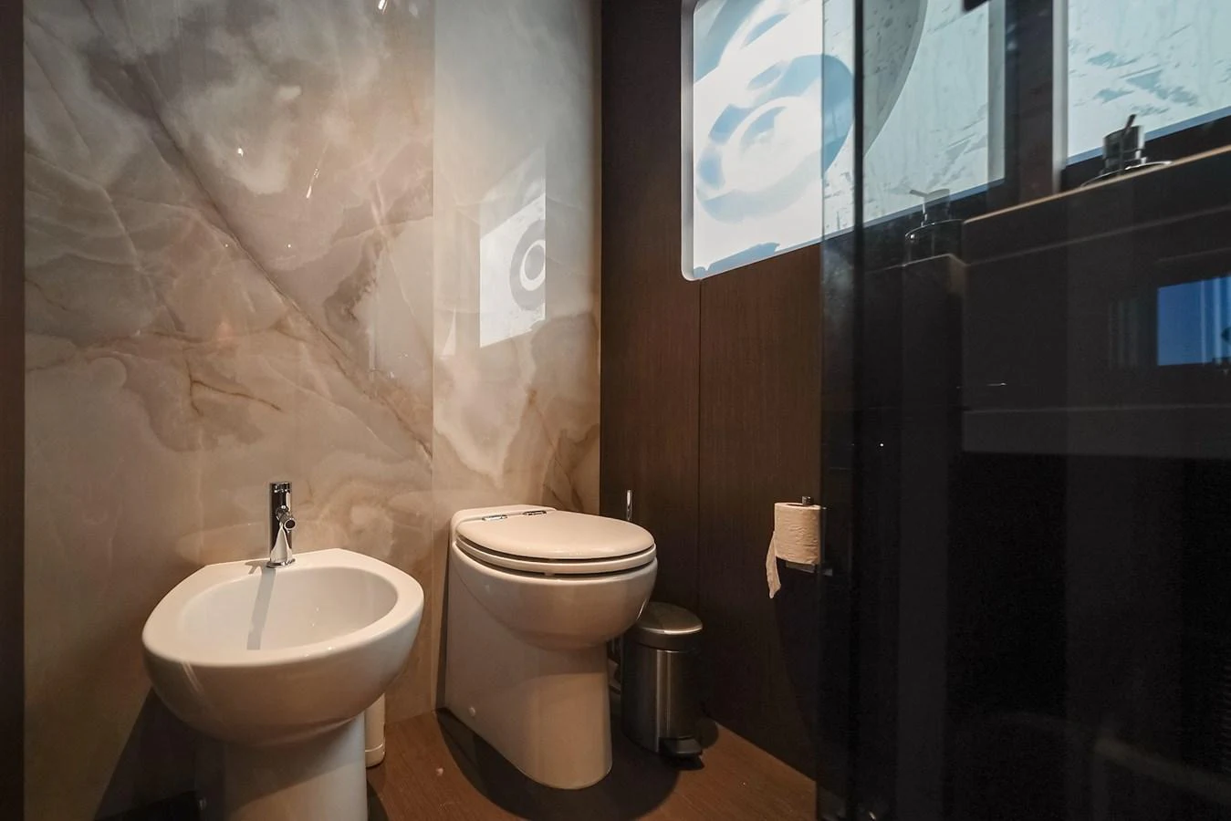 The yacht's bathroom features modern fixtures and a sleek design. aboard SEA SAKURA Yacht for Sale