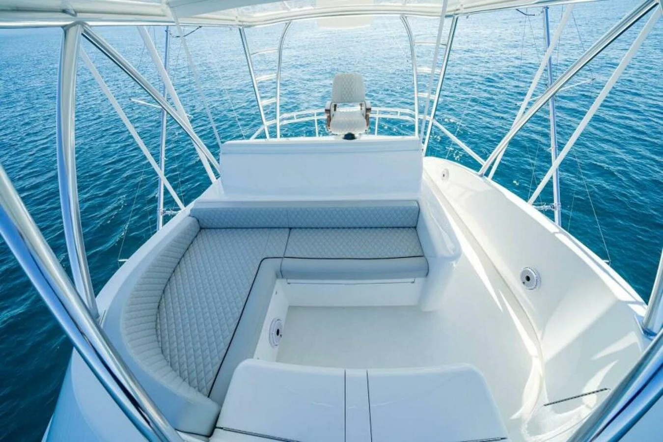 The flybridge offers a spacious seating area with stunning views of the surrounding waters. aboard 2027 VIKING 90SB Yacht for Sale
