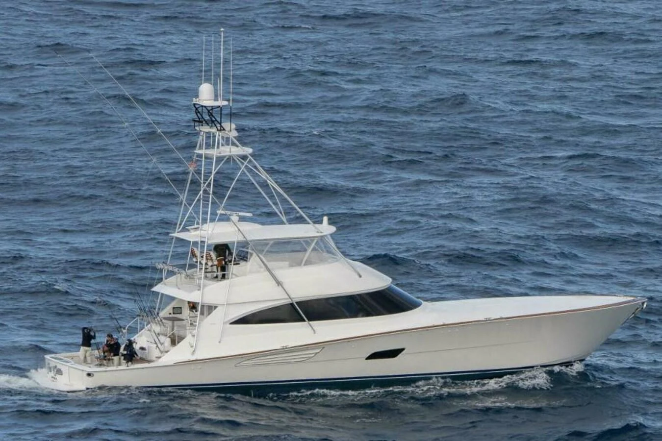 A sleek and modern yacht cruises smoothly through the open sea. aboard 2027 VIKING 90C Yacht for Sale