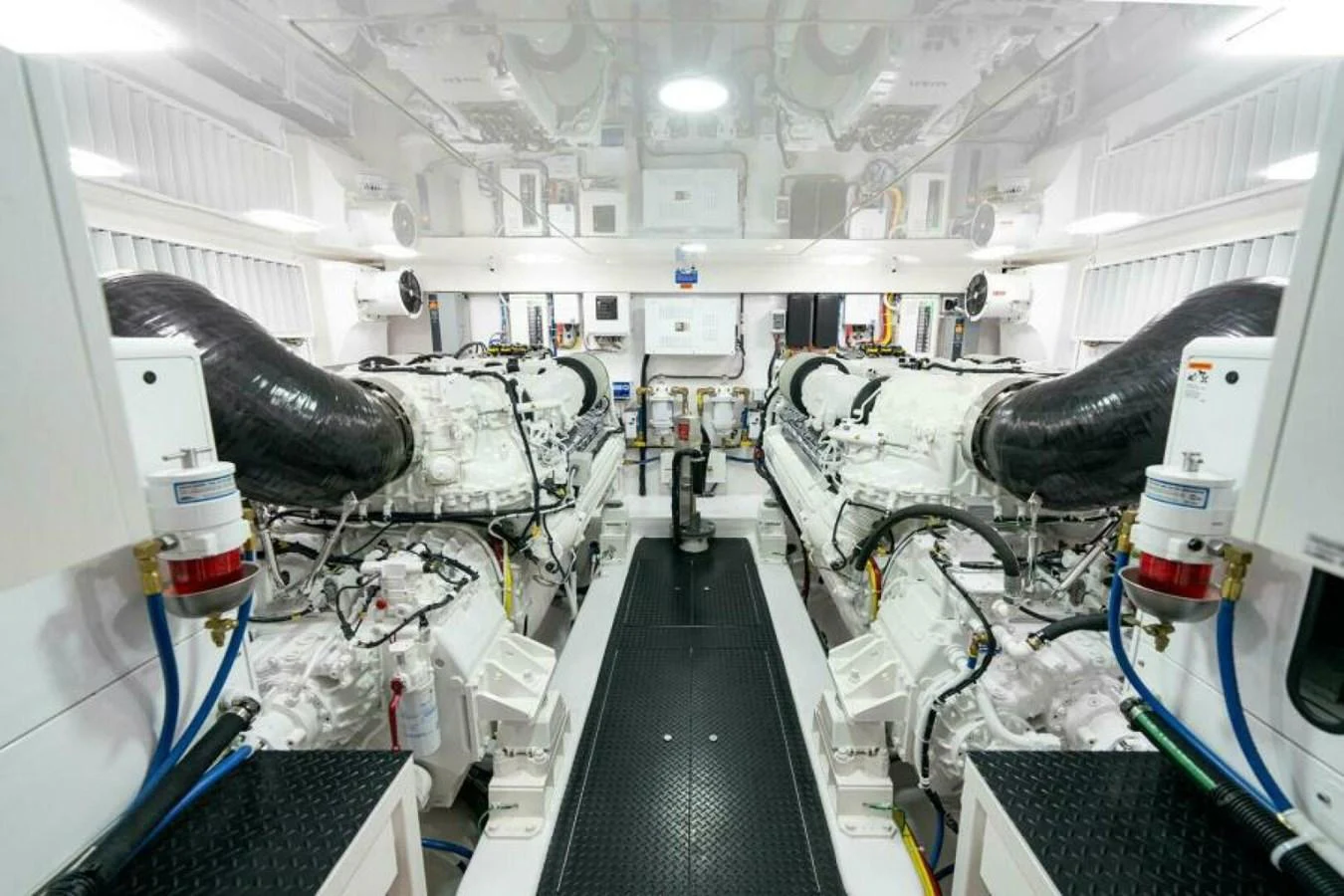 The engine room showcases powerful and meticulously maintained machinery. aboard 2027 VIKING 90C Yacht for Sale