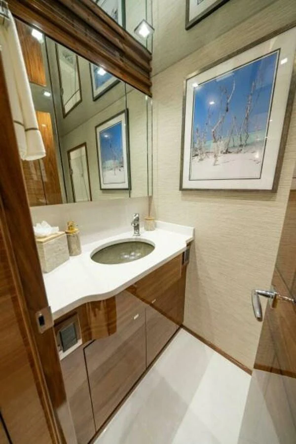The yacht's bathroom features a sleek design with modern fixtures and elegant decor. aboard 2027 VIKING 90C Yacht for Sale