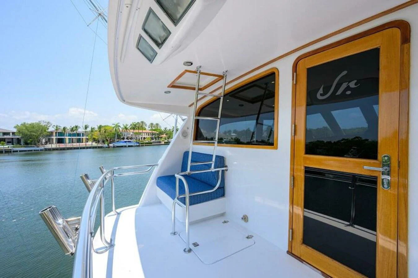 The aft deck features a cozy seating area with a view of the serene waters. aboard JUNIOR Yacht for Sale