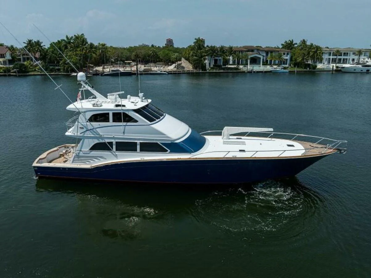 A sleek yacht cruises gracefully on calm waters, showcasing its elegant design and spacious deck areas. aboard JUNIOR Yacht for Sale
