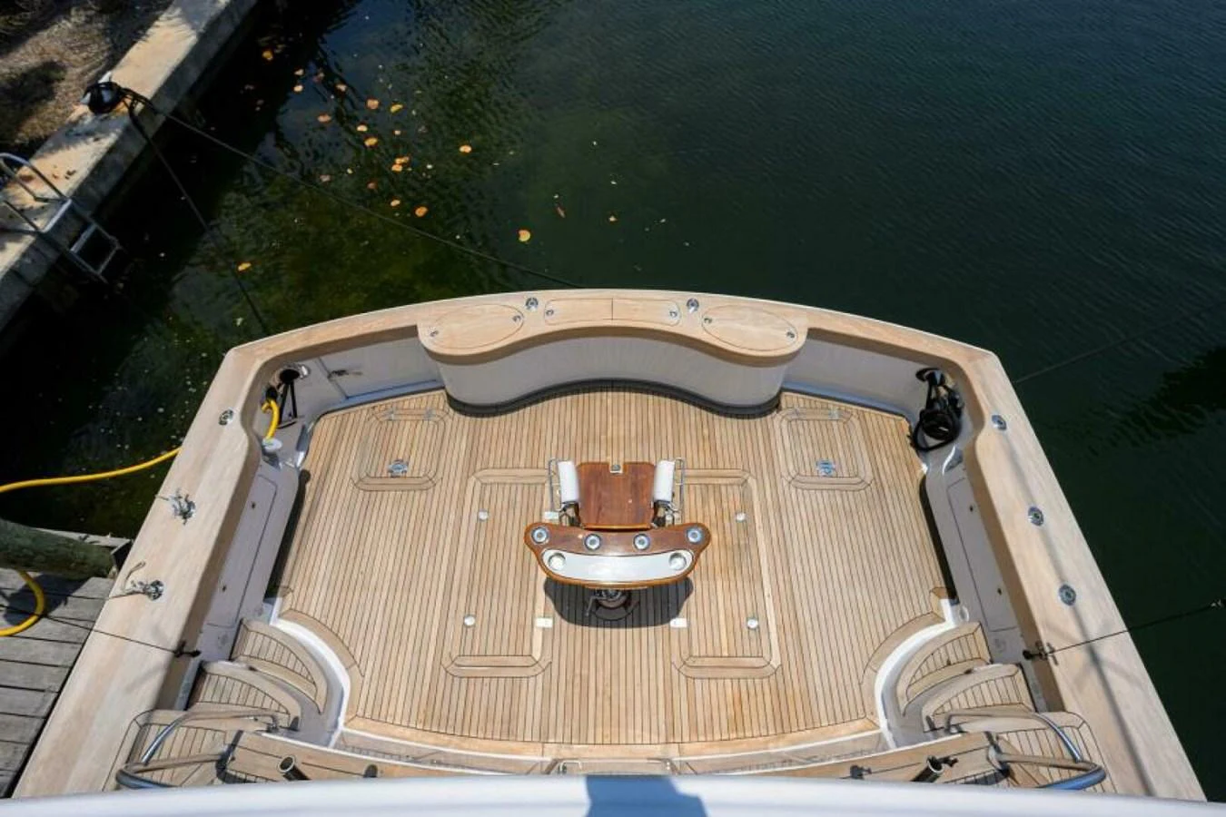 The yacht's aft deck features a spacious and well-appointed area for relaxation and activities. aboard JUNIOR Yacht for Sale