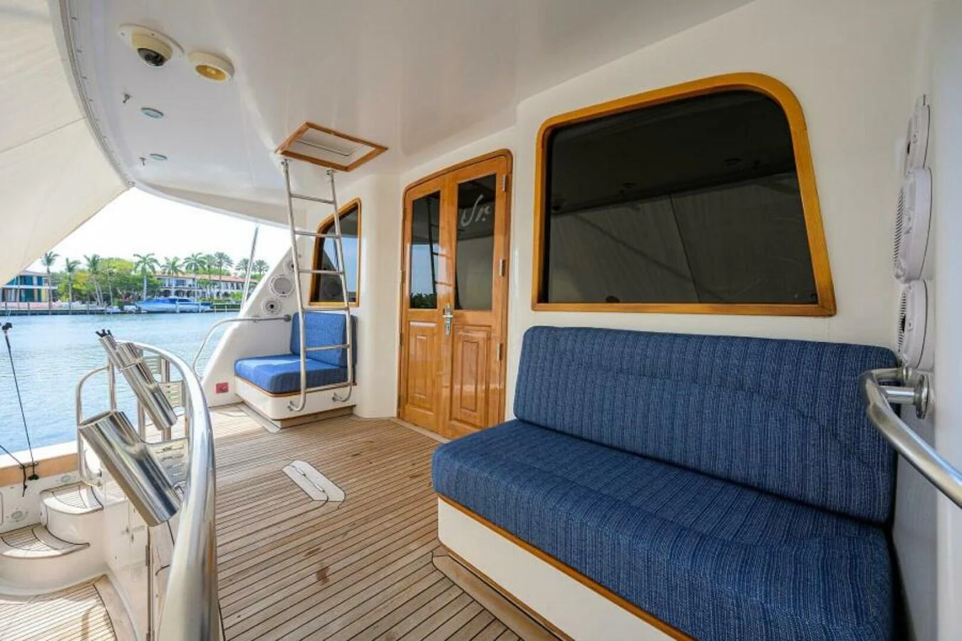 The aft deck features comfortable seating with a view of the water, perfect for relaxation. aboard JUNIOR Yacht for Sale