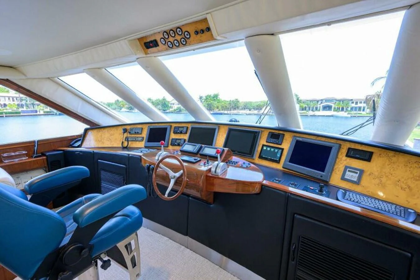 The helm of the yacht features advanced navigation equipment and luxurious seating with a panoramic view. aboard JUNIOR Yacht for Sale