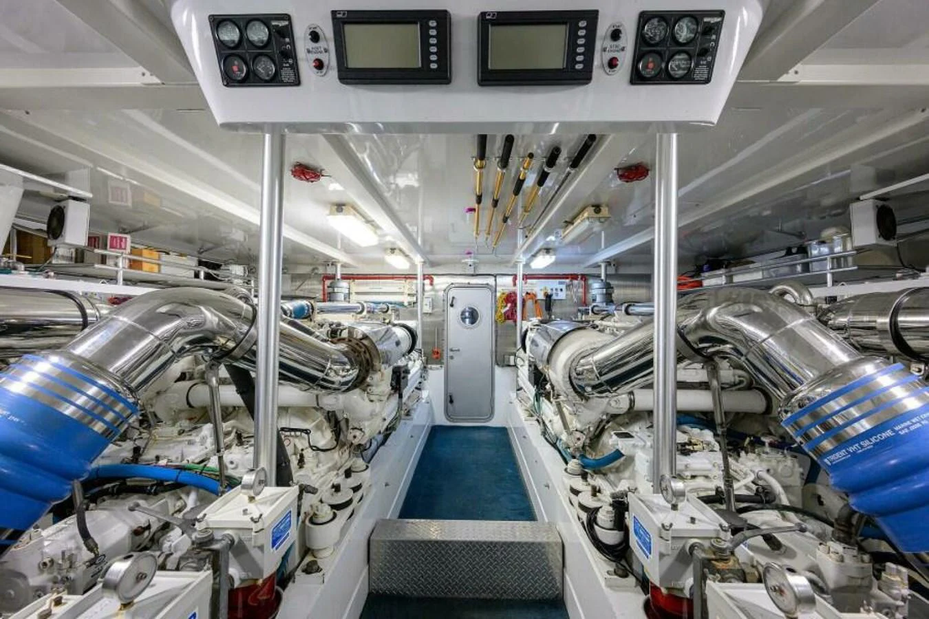 The engine room showcases the yacht's powerful and meticulously maintained machinery. aboard JUNIOR Yacht for Sale