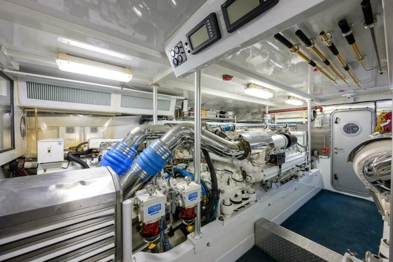 The engine room showcases the yacht's powerful and meticulously maintained machinery. aboard JUNIOR Yacht for Sale