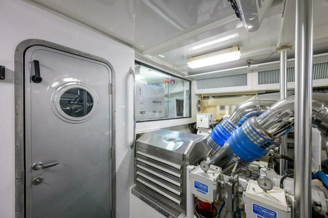The engine room showcases the yacht's advanced mechanical systems and pristine maintenance. aboard JUNIOR Yacht for Sale