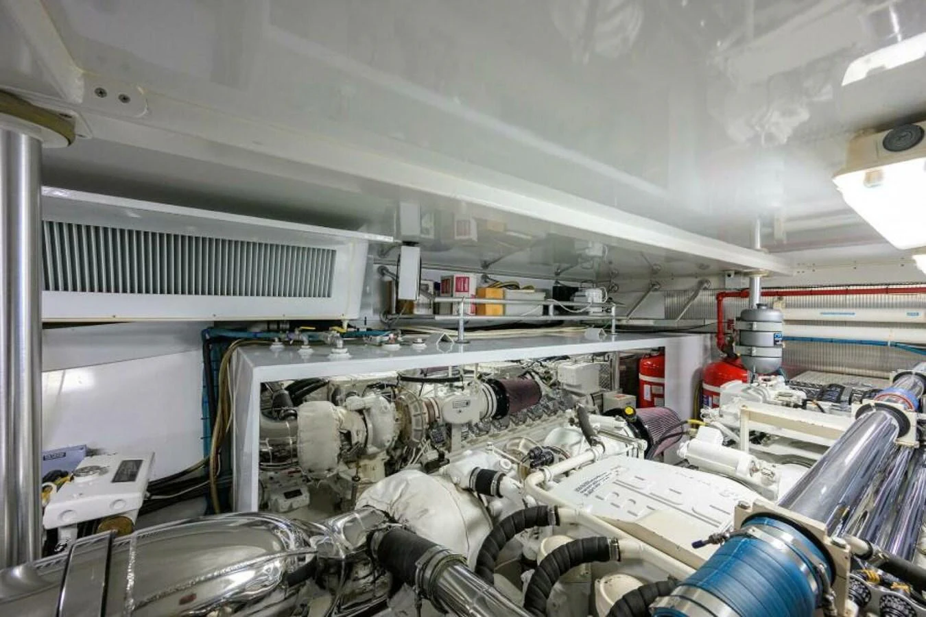 The yacht's engine room showcases a well-organized and meticulously maintained mechanical space. aboard JUNIOR Yacht for Sale