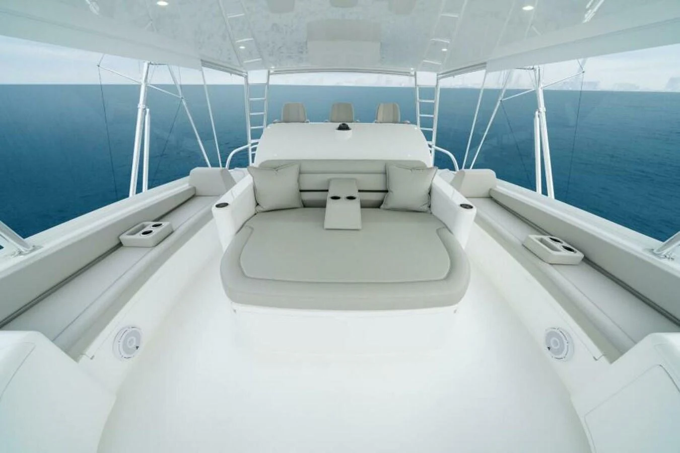 The flybridge offers a spacious and comfortable seating area with panoramic ocean views. aboard 2027 VIKING 82C Yacht for Sale