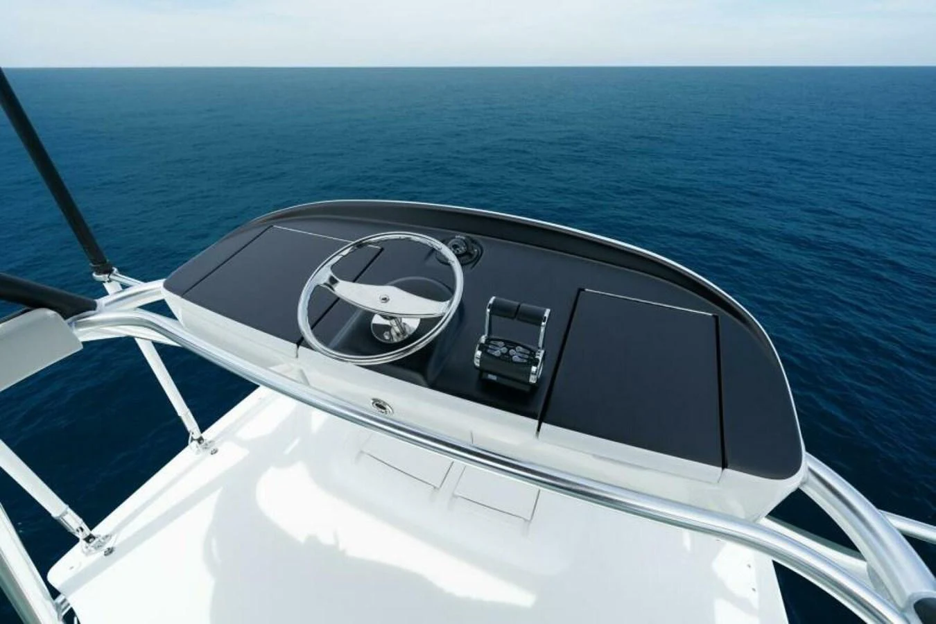 A sleek and modern helm station with a minimalist design overlooking the open sea. aboard 2027 VIKING 82C Yacht for Sale