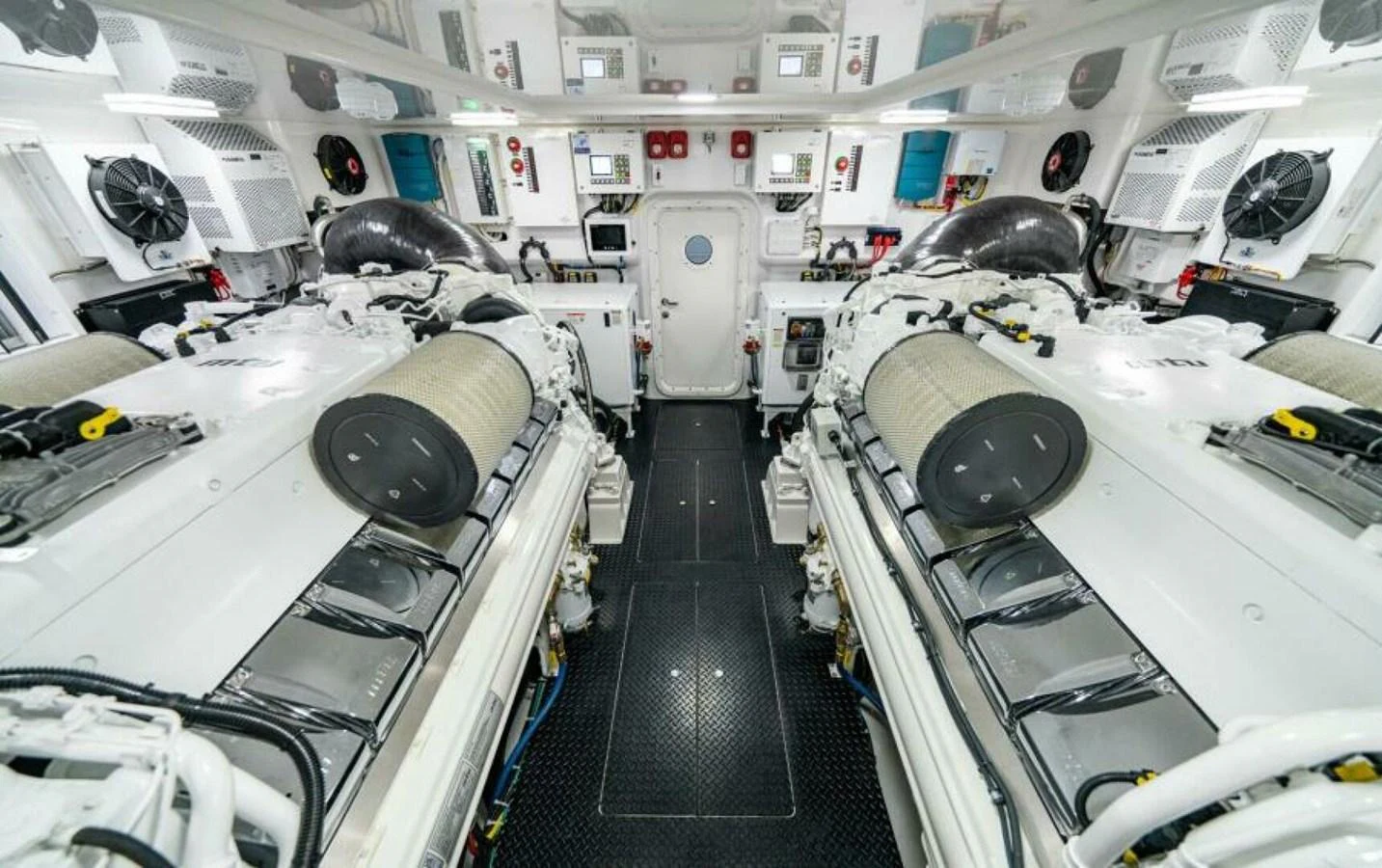 The image showcases a pristine and well-organized engine room with advanced machinery. aboard 2027 VIKING 82C Yacht for Sale