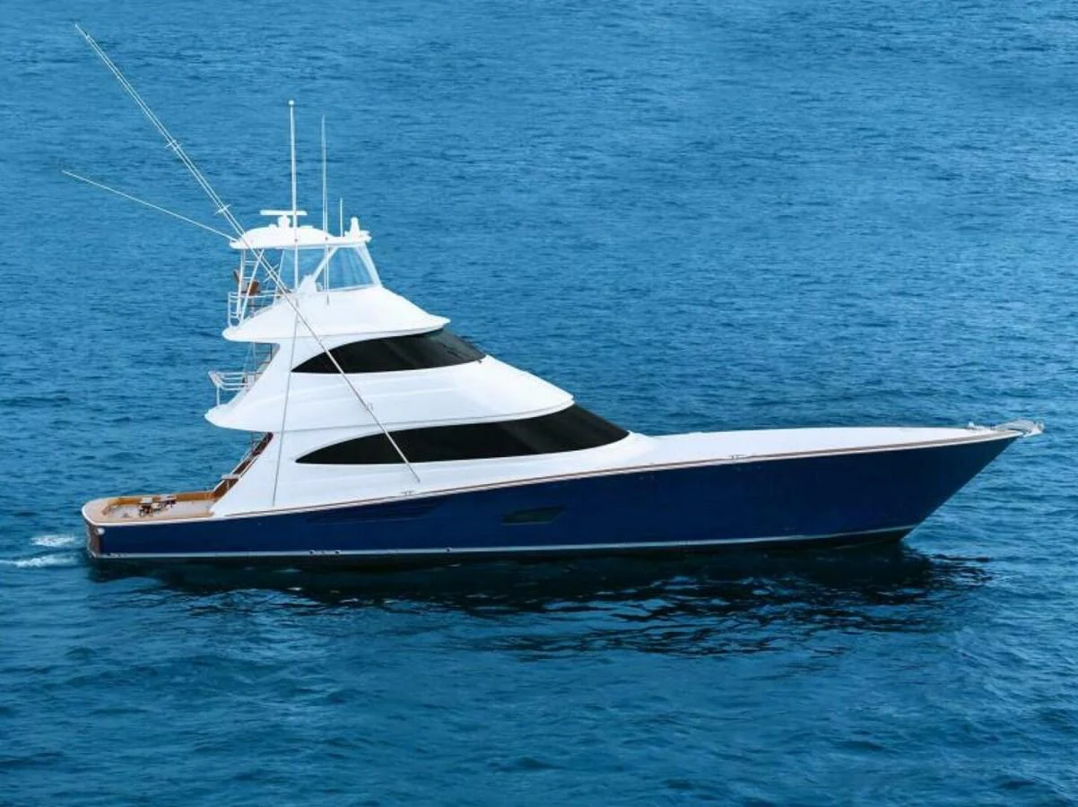 A sleek and modern yacht glides gracefully over the deep blue water. aboard 2027 VIKING 82SB Yacht for Sale