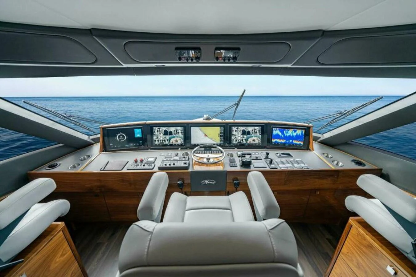 The helm station offers a commanding view with state-of-the-art navigation equipment and luxurious seating. aboard 2027 VIKING 82SB Yacht for Sale