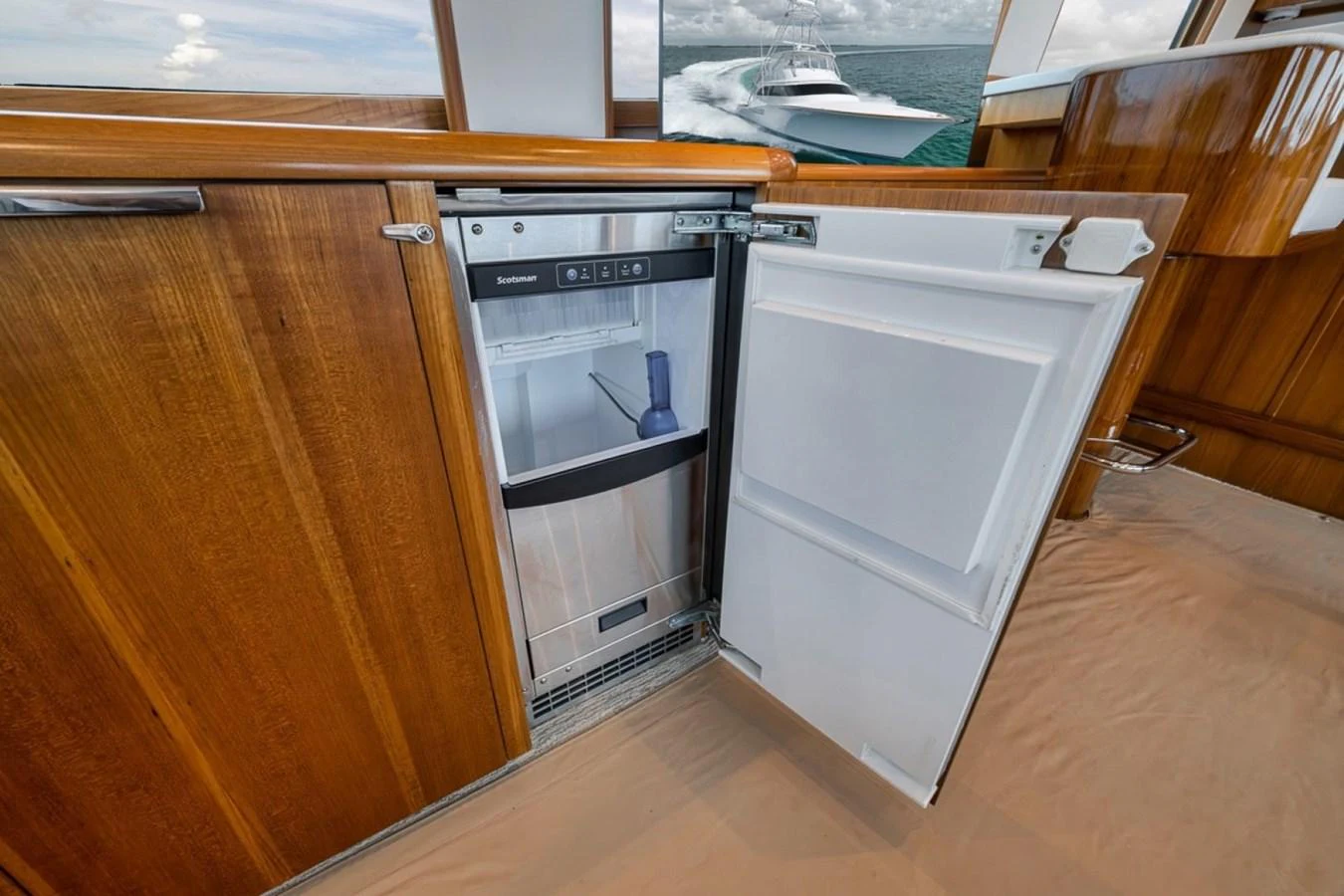 A compact built-in refrigerator in the galley, showcasing practical storage solutions. aboard GENESIS Yacht for Sale