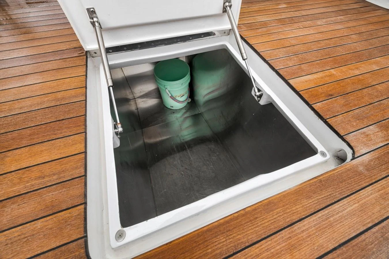 A close-up view of a storage compartment on the yacht's deck, showcasing practical storage space. aboard GENESIS Yacht for Sale