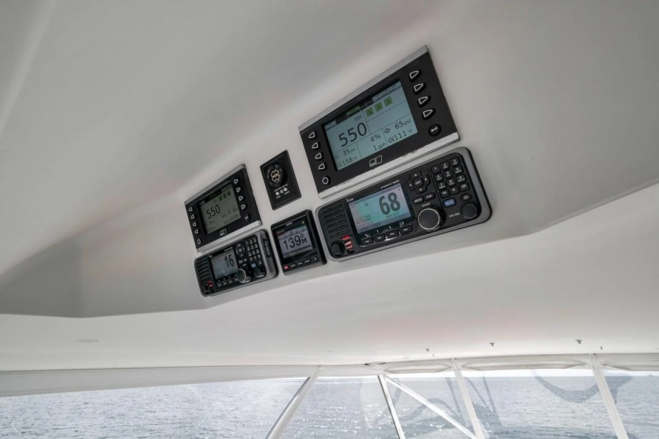 The helm features advanced navigation and communication instruments for a seamless sailing experience. aboard GENESIS Yacht for Sale