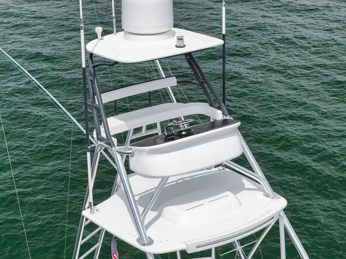 The image showcases the flybridge of a yacht, featuring a sleek and modern design with a focus on functionality. aboard GENESIS Yacht for Sale