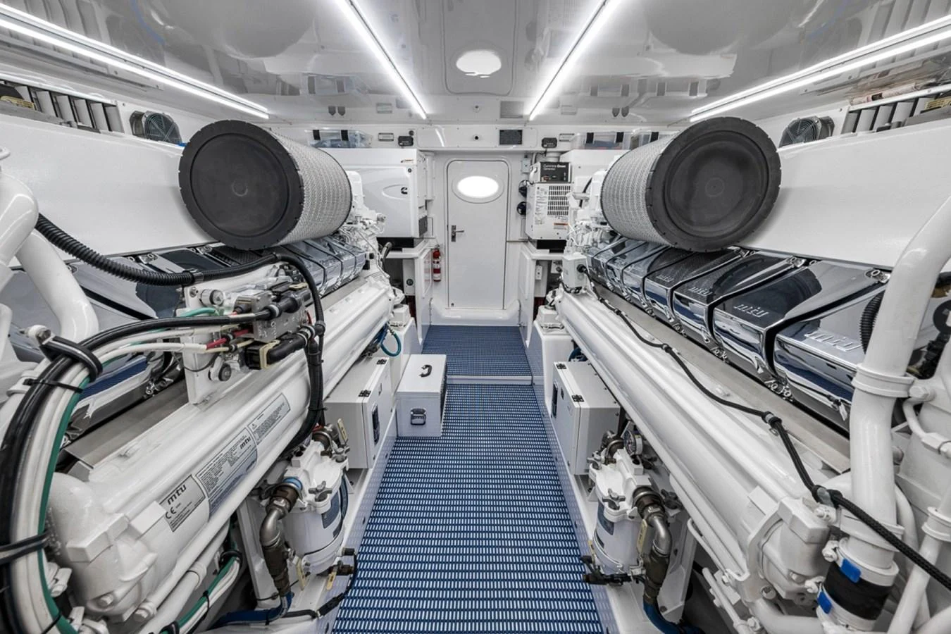 The engine room showcases a meticulously maintained and highly functional space with advanced machinery. aboard GENESIS Yacht for Sale