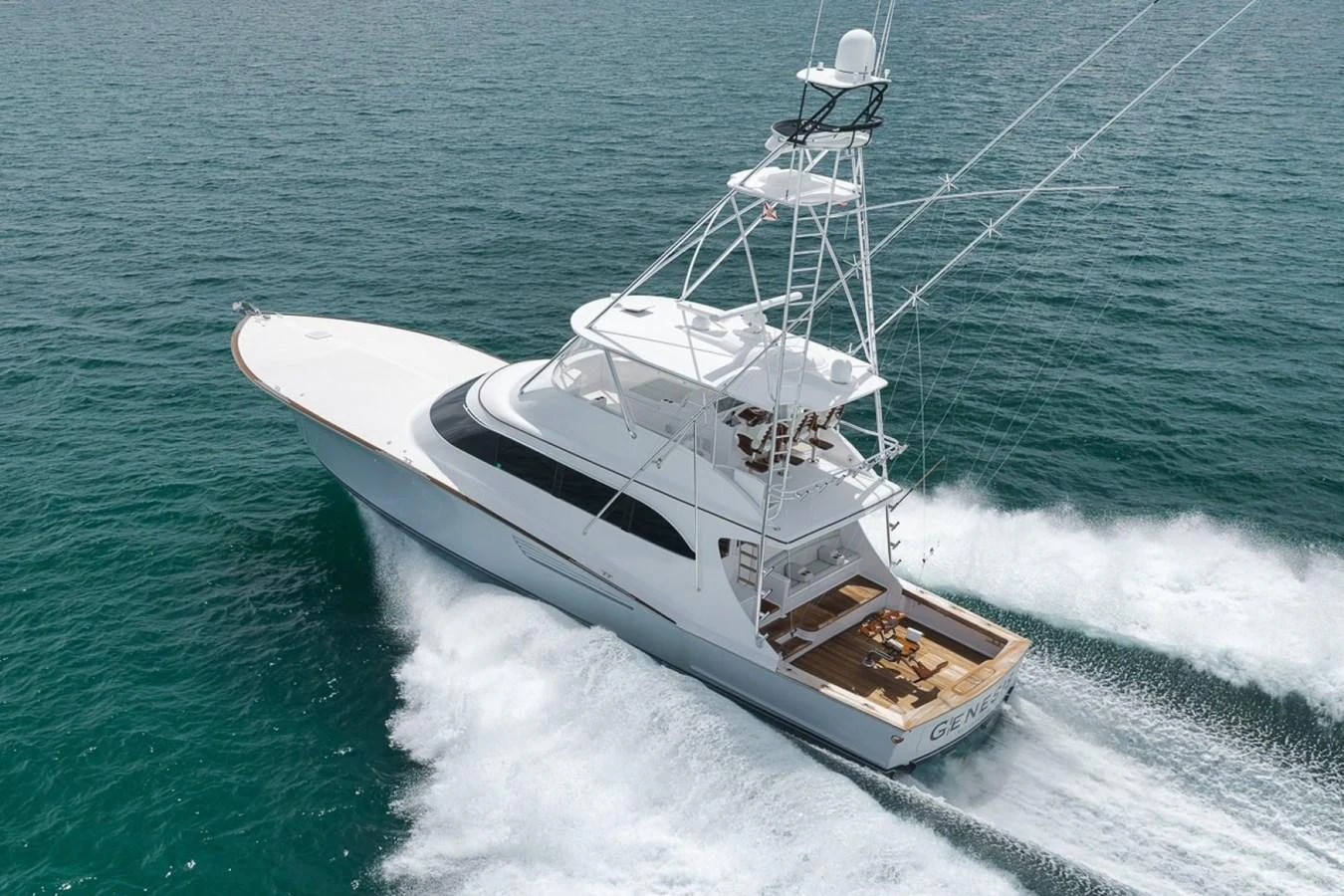 A sleek yacht cruises swiftly through the water, showcasing its elegant design and powerful performance. aboard GENESIS Yacht for Sale