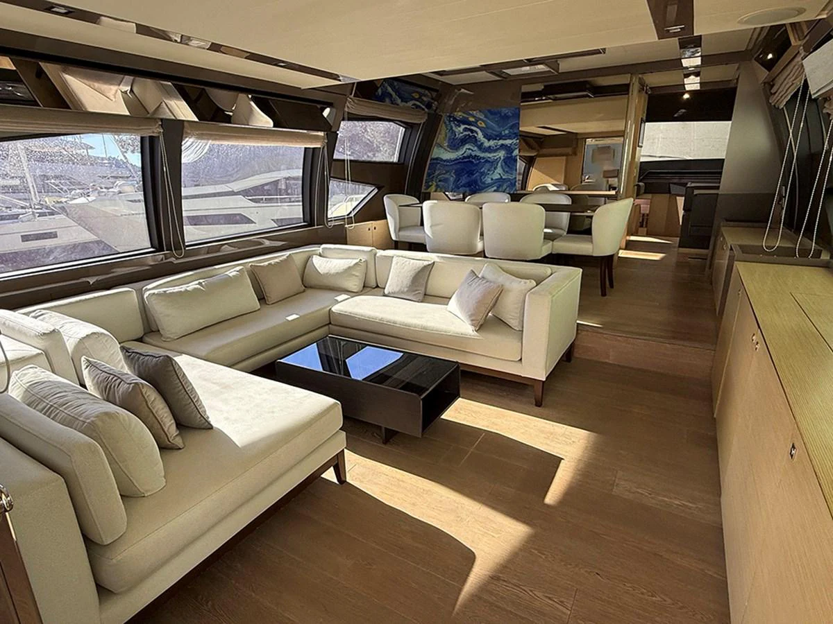 The salon features a spacious and elegant seating area with large windows providing ample natural light. aboard LA LUNA Yacht for Sale