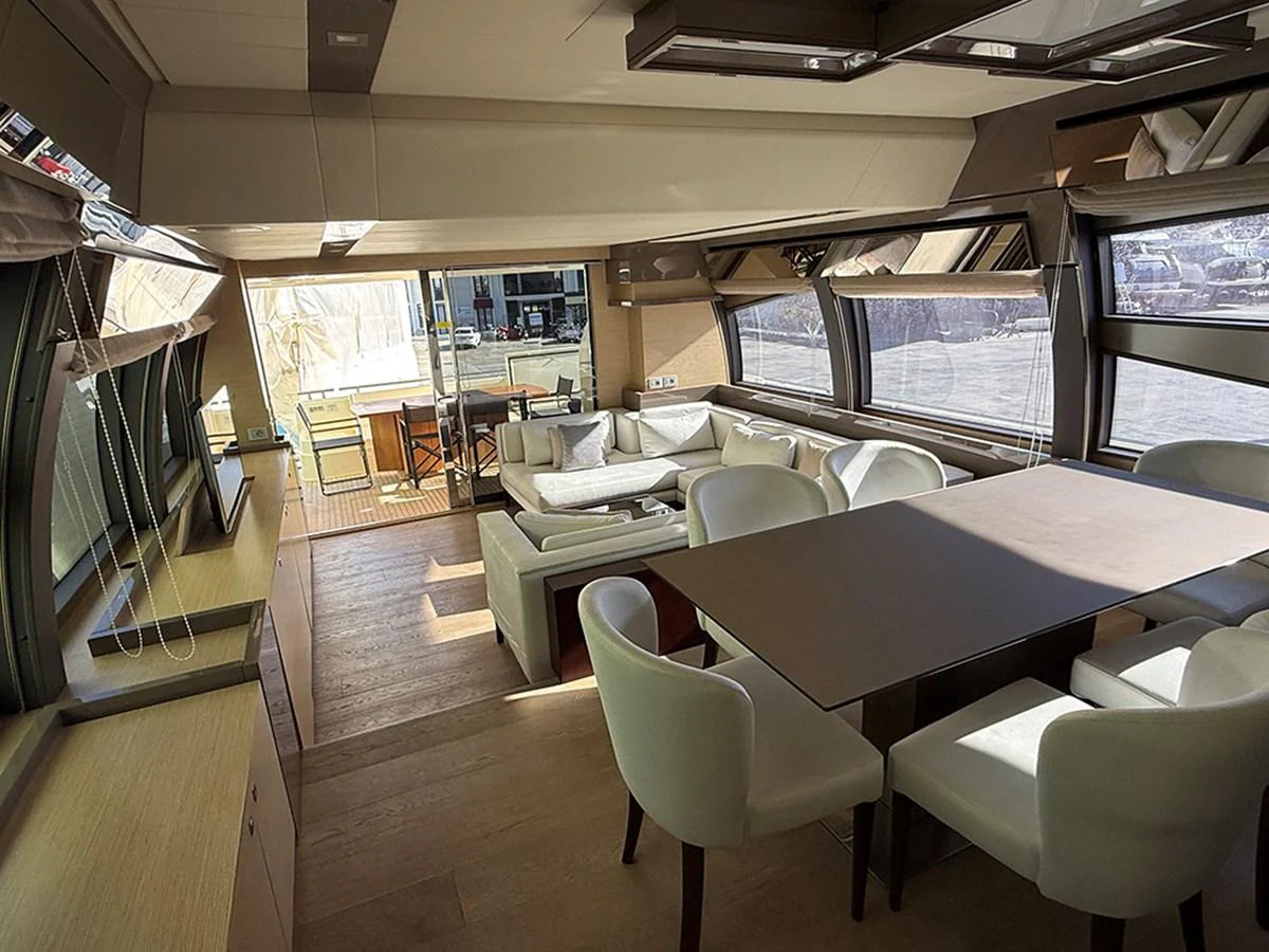The salon features a spacious dining area with large windows providing ample natural light. aboard LA LUNA Yacht for Sale
