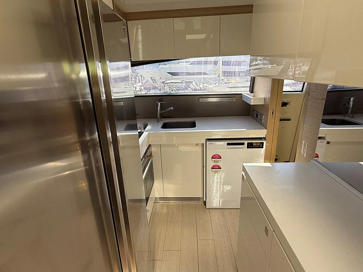 The yacht's galley is equipped with modern appliances and sleek cabinetry, offering a functional and stylish space for meal preparation. aboard LA LUNA Yacht for Sale