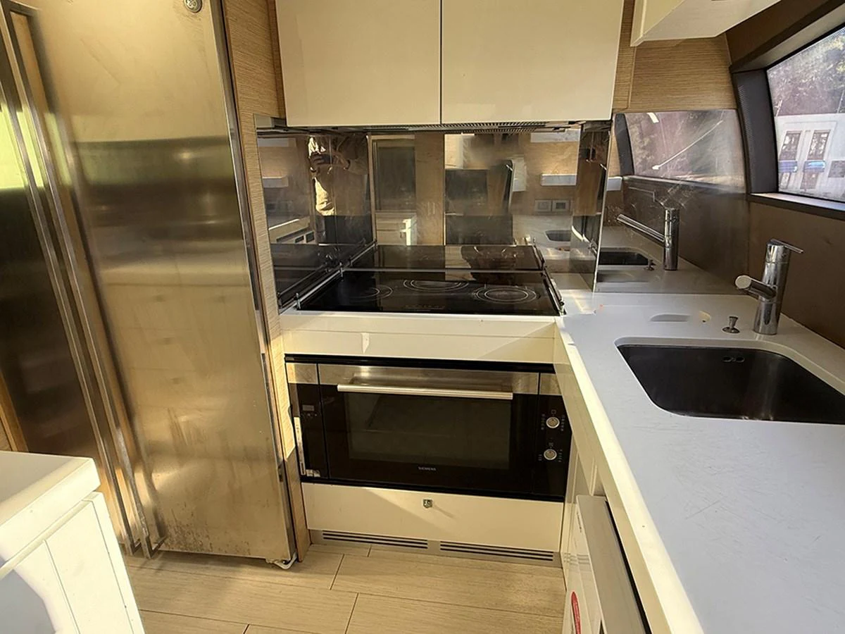 The yacht's galley is equipped with modern appliances and sleek finishes, offering a functional and stylish cooking space. aboard LA LUNA Yacht for Sale