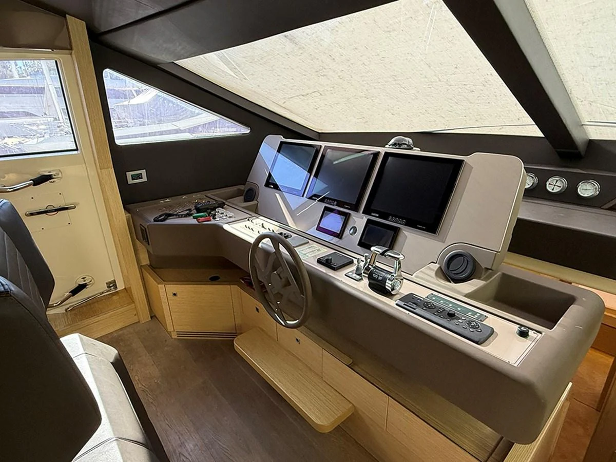 The helm station features advanced navigation equipment and a sleek, modern design. aboard LA LUNA Yacht for Sale