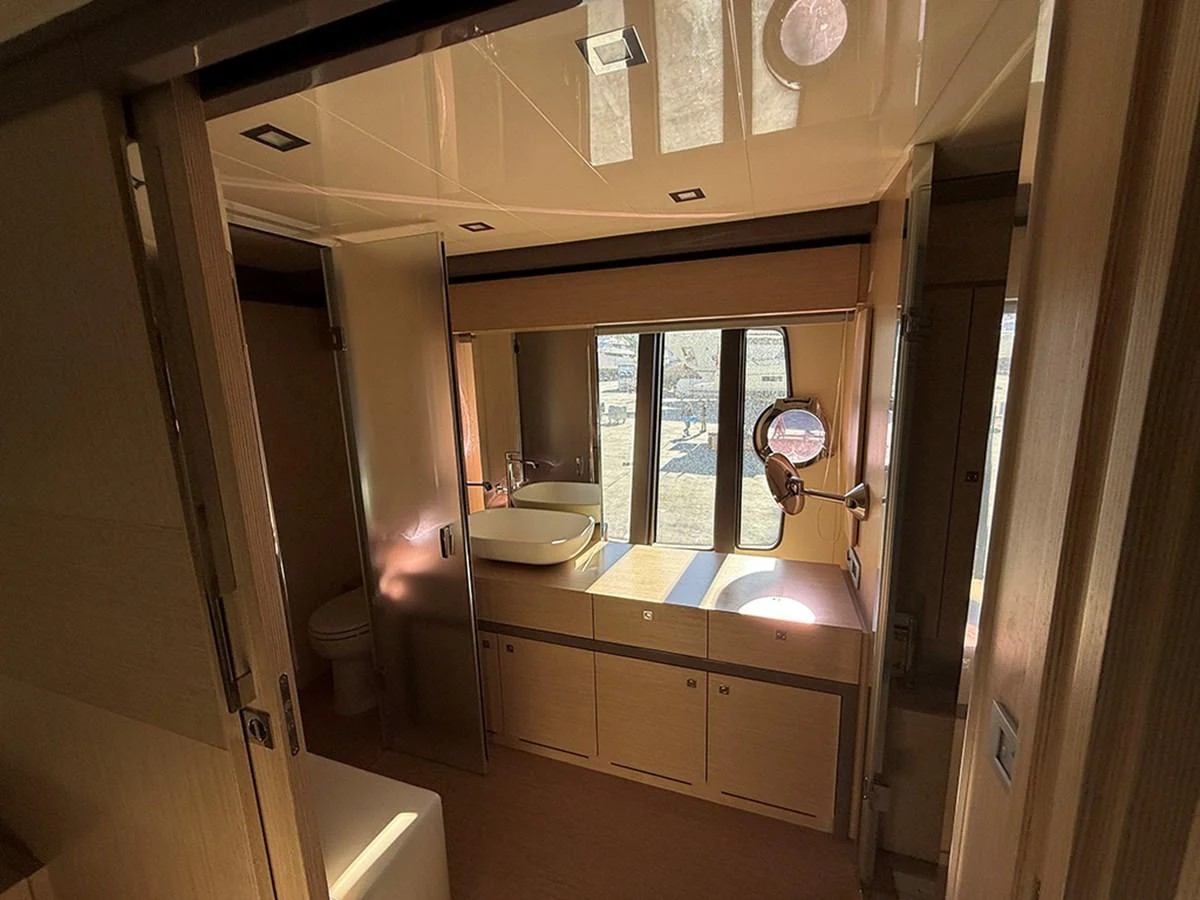 The yacht's bathroom features a modern design with ample natural light and sleek fixtures. aboard LA LUNA Yacht for Sale